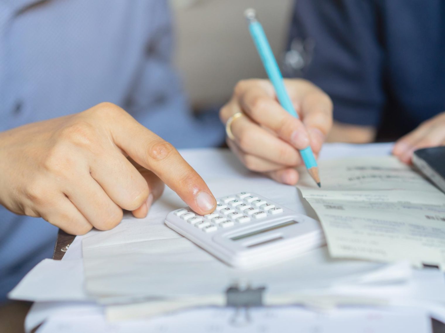 A couple reviewing their mortgage paperwork and financial statements.