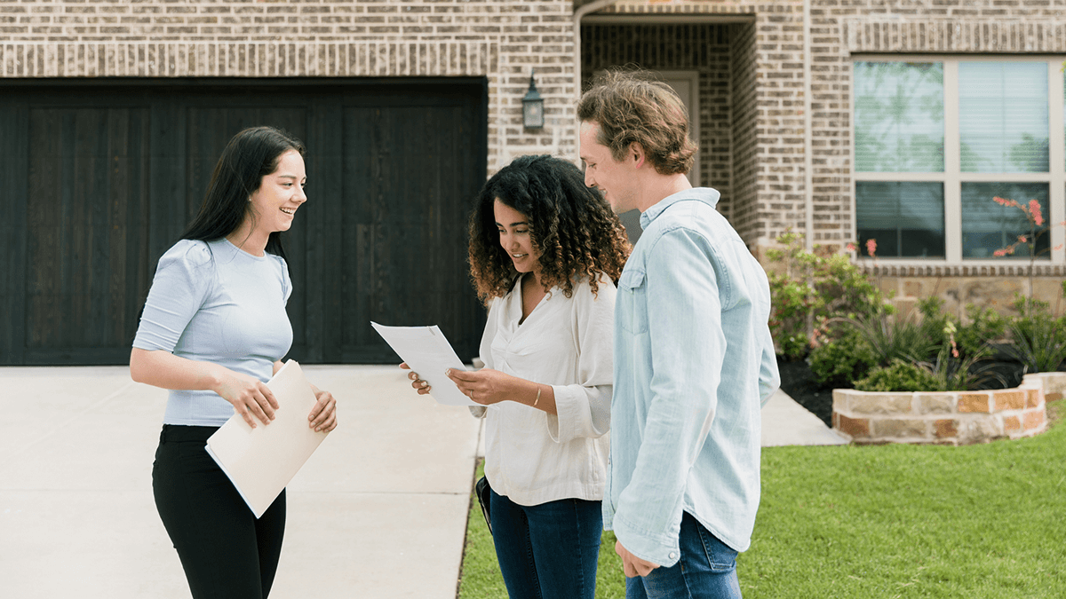 Couple discussing home price with the seller.