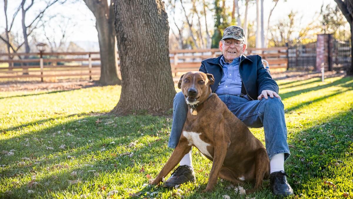 Retired military man with dog.