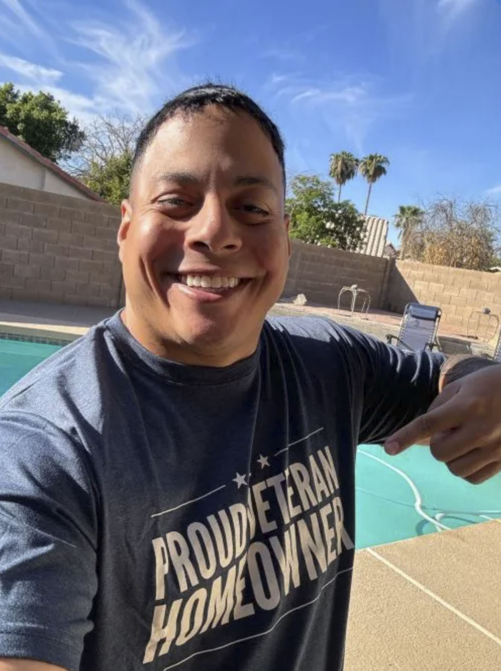 picture of Jonathan M. in front of a house