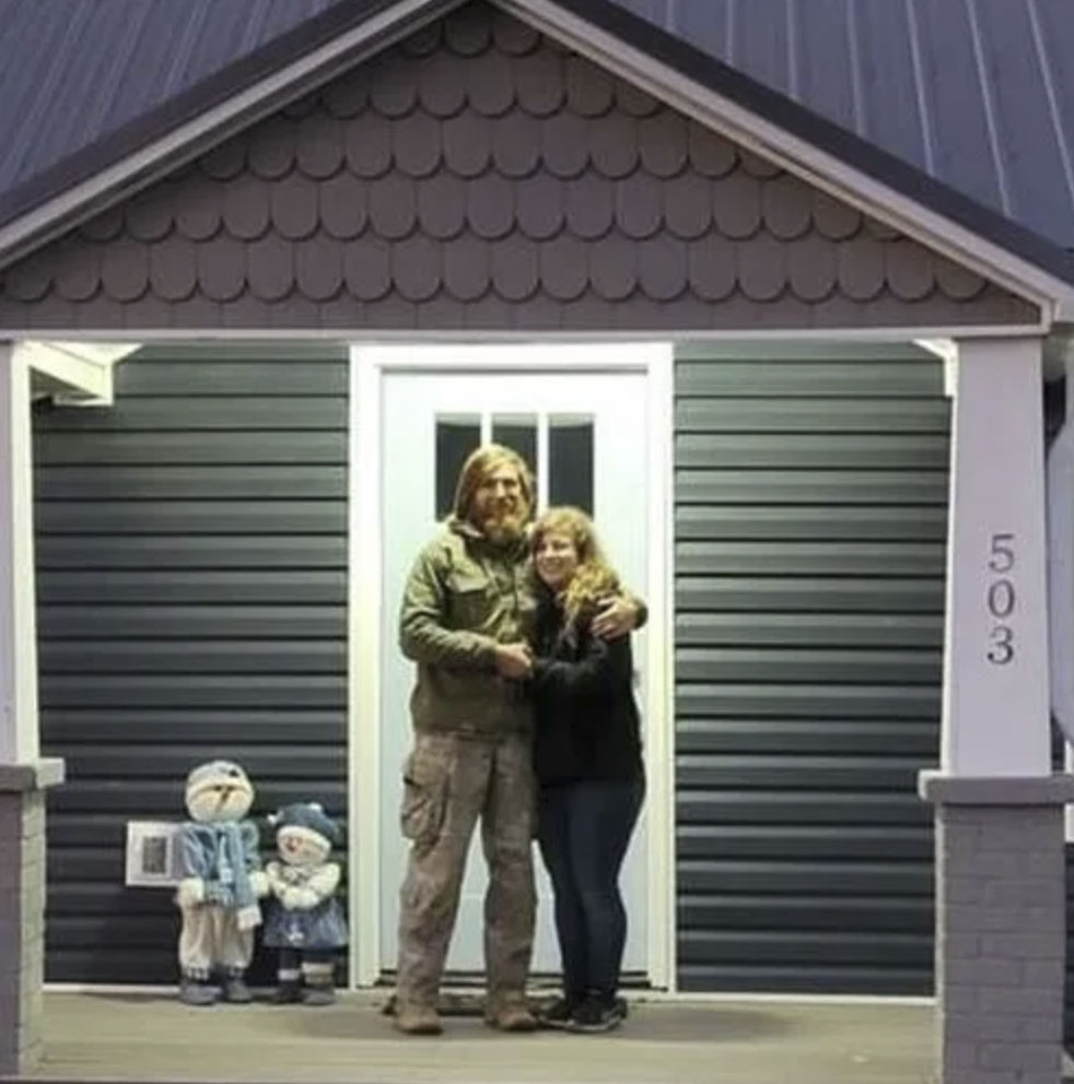 picture of Floyd B. in front of a house