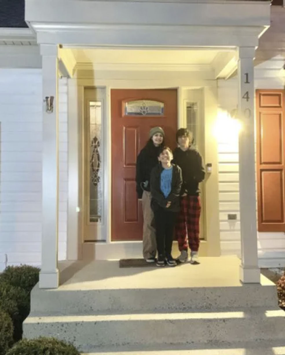 picture of Eric L. in front of a house